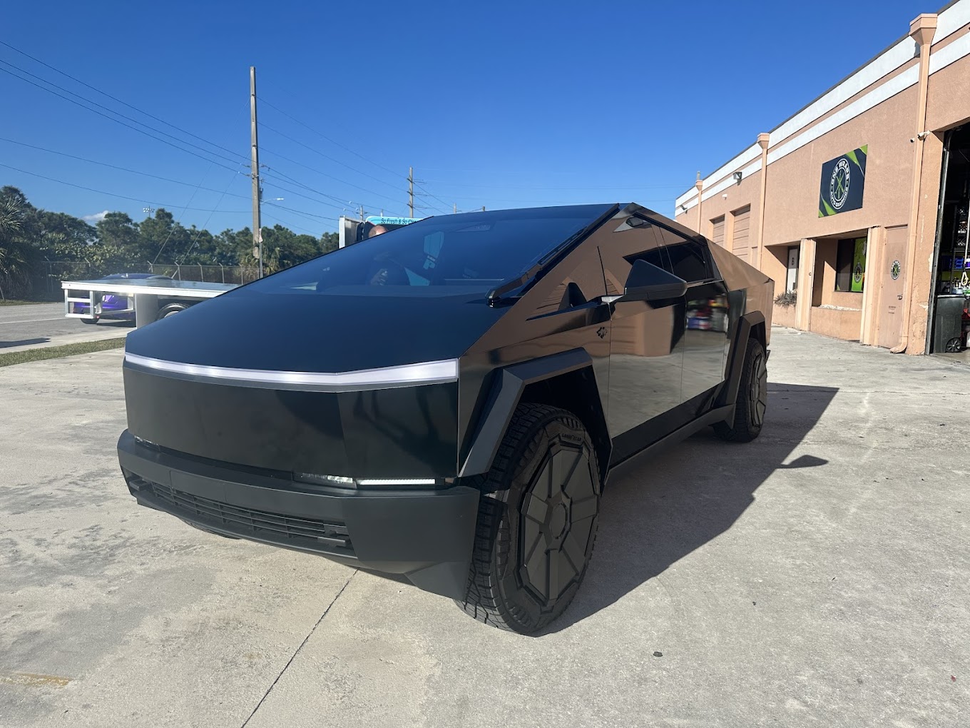 black cybertruck in west palm beach with wrap